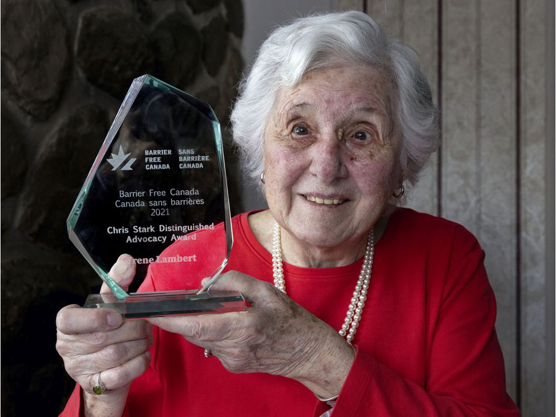 Portrait of Irene Lambert receiving the Chris Stark Distinguished Advocacy Award